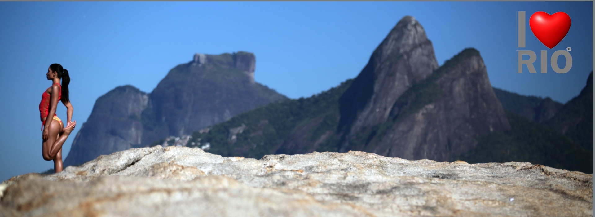  Rio de Janeiro, Brazil - yoga at Arpoador, with Dois Irmaos in the background and Pedra da Gavea 