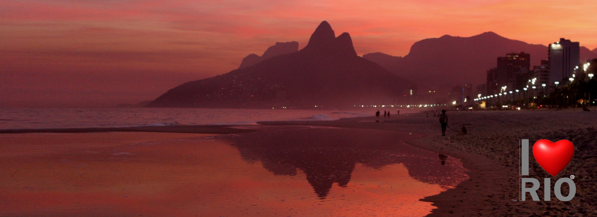 Rio de Janeiro, Brazil -  woman showering on ipanema beach, dois irmaos in the background  